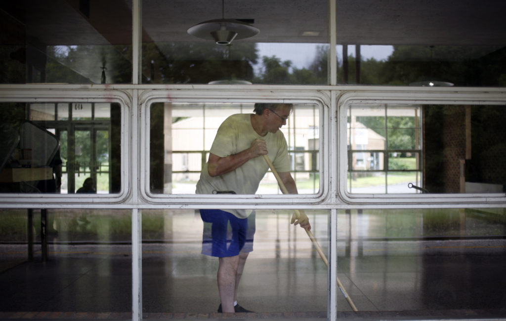 Preservation group helps clean, restore train depot News, Sports